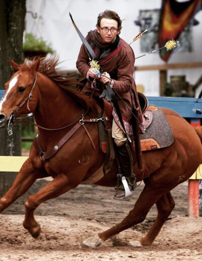 Hadley riding Micky during an archery competition.